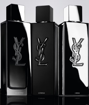Three YSL perfume bottles on a reflective surface with a light gray background