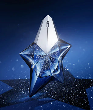 Star-shaped perfume bottle on a dark blue background
