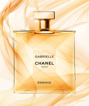 Chanel Gabrielle perfume bottle with gold and white design on a white background