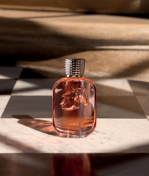 Ceramic bottle with horse emblem on a marble surface with soft lighting