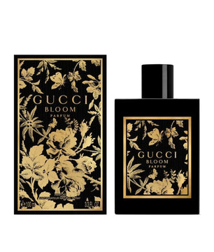 Gucci Bloom perfume bottle and packaging with floral design on a white background