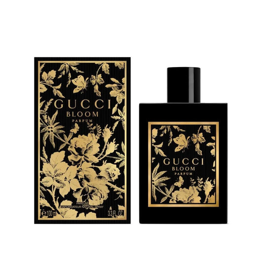 Gucci Bloom perfume bottle and packaging with floral design on a white background
