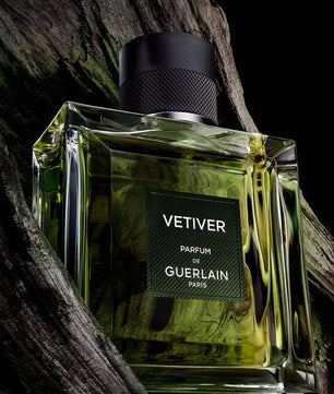 Perfume bottle of Vetiver by Guerlain on a dark background