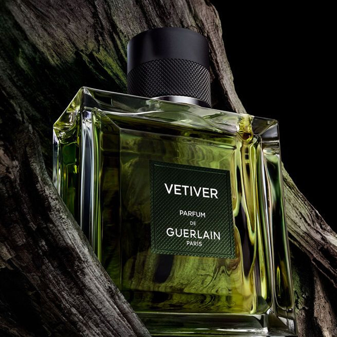 Perfume bottle of Vetiver by Guerlain on a dark background