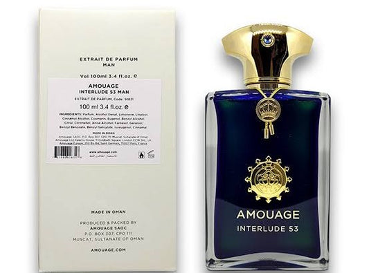 Amouage Interlude 53 Man Extrait de Parfum bottle next to its cream-colored packaging box, featuring a dark blue glass bottle with gold detailing and a gold cap.