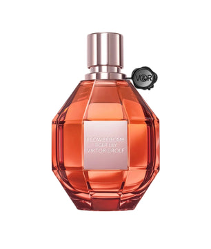 Orange perfume bottle with silver cap on a white background