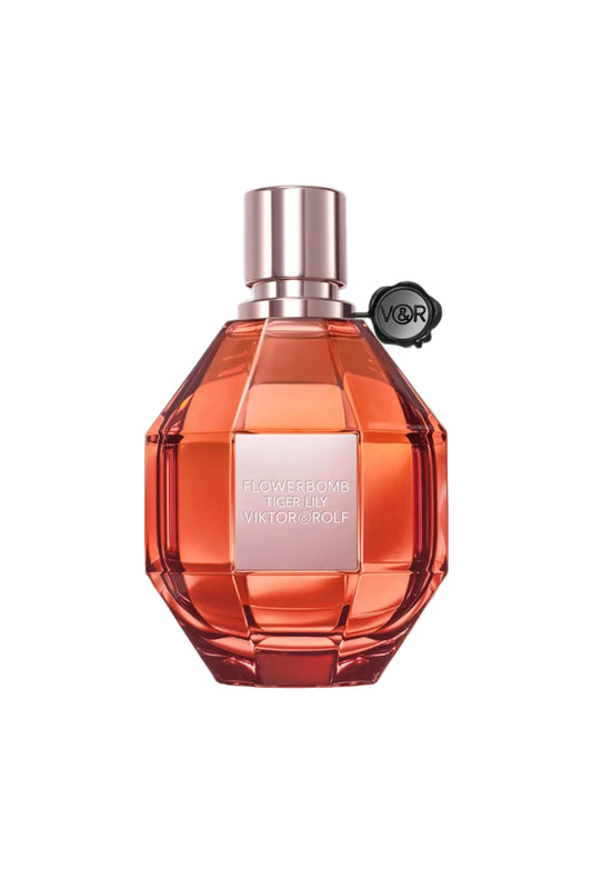 Orange perfume bottle with silver cap on a white background