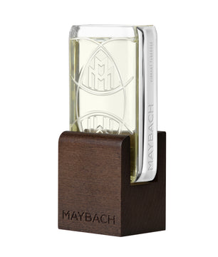 Maybach perfume bottle with wooden base on a white background