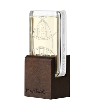 Maybach perfume bottle with wooden base on a white background
