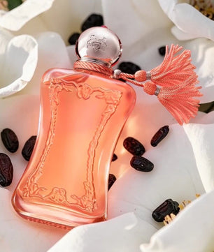 Perfume bottle with decorative elements on a floral background