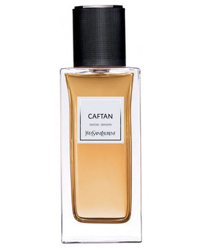 Perfume bottle labeled 'Caftan' by Yves Saint Laurent on a white background