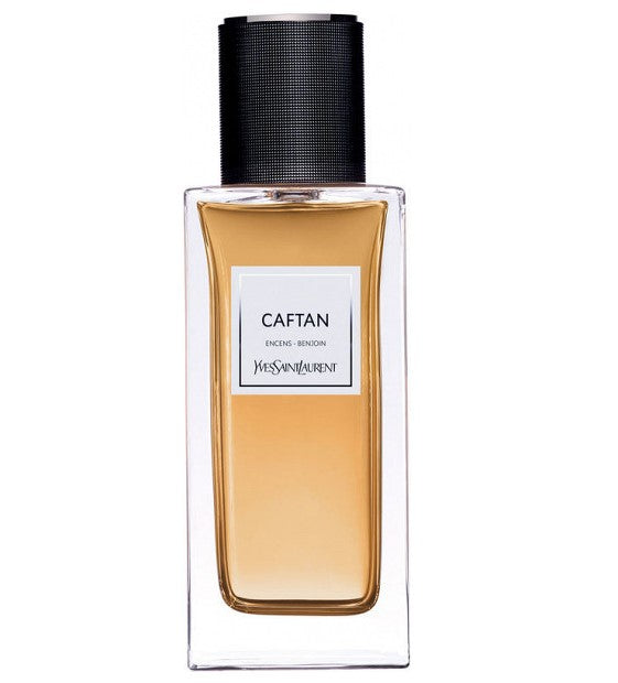 Perfume bottle labeled 'Caftan' by Yves Saint Laurent on a white background