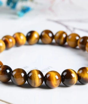 Tiger eye beaded bracelet on a white surface