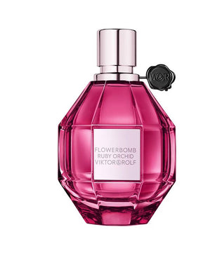 Pink perfume bottle with silver cap on a white background