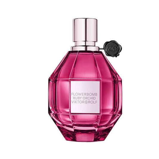 Pink perfume bottle with silver cap on a white background