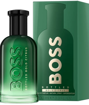 Green BOSS bottled perfume with packaging on a white background