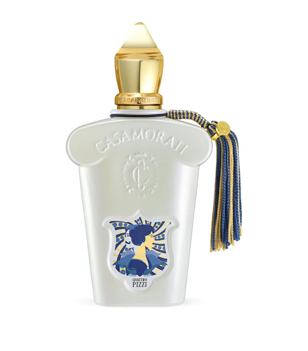 Casamorati perfume bottle with gold cap and decorative elements on a white background