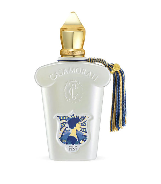 Casamorati perfume bottle with gold cap and decorative elements on a white background